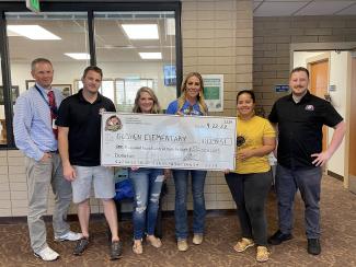 Donation check of $1299.51 from Chubby's in Payson